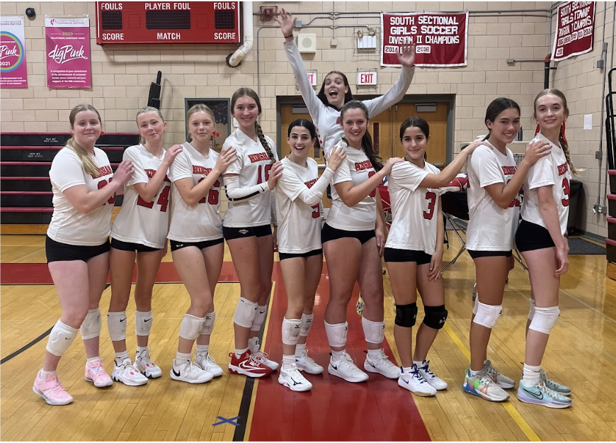 HHS student-athletes that are involved in the high school volleyball program, at a home game in the school gym.