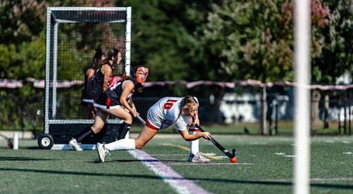 Senior Captain Haylen Wilson does the honors for Hingham in an offensive corner during Wednesday’s game against Whitman Hanson (9/11).