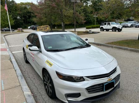 Image taken by Oliver Ruccio on Apple iPhone 14. Image depicts a student driver car about to be taken out for one on one driving hours with David Jacobs, an instructor at HHS Driver’s Ed.
