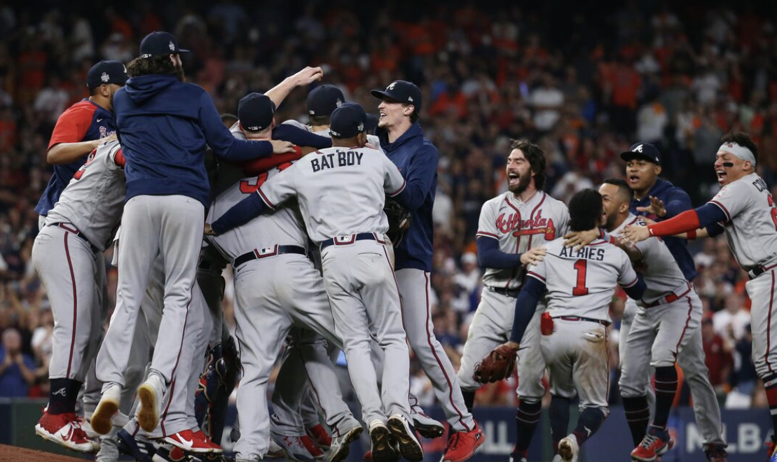 The Atlanta Braves celebrate after winning game six of the 2021 world series against the Houston Astros.