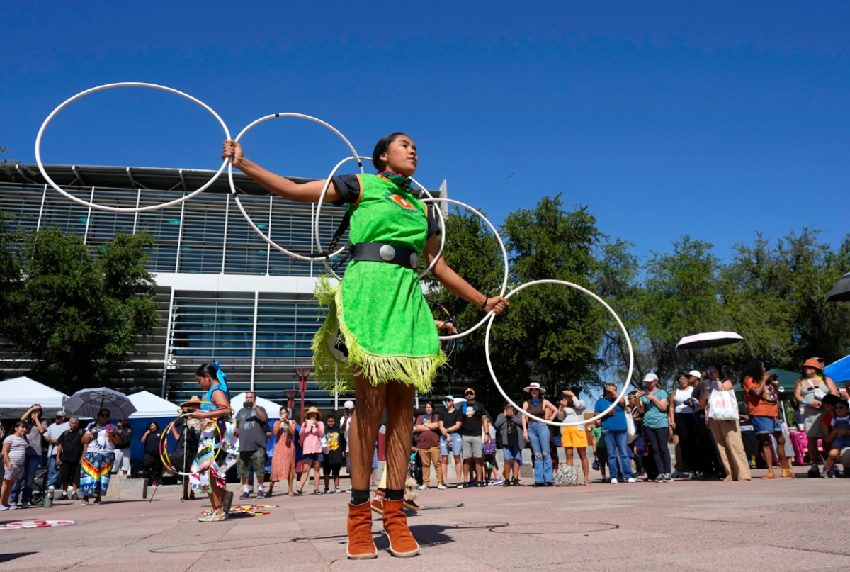 Performers from the Native American Hoop Dance of Ballet Arizona dancing at a celebration for Indigenous People’s Day (Ross D. Franklin).
