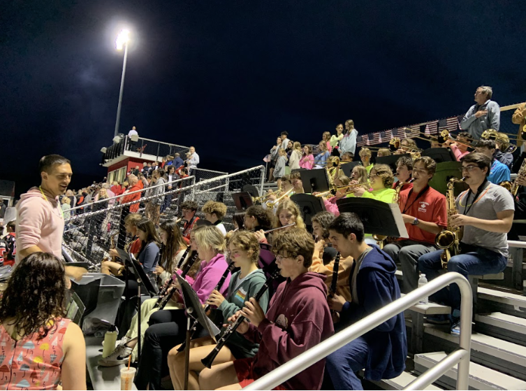 HHS band students, conducted by Mr. Cincotta playing the national anthem in the HHS stands at the recent neon Hingham vs. Plymouth North home game on Oct 4, 2024.