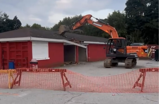 The demolition of Hingham’s old concession stand as it prepares to become to foundation for “The Dock Project”