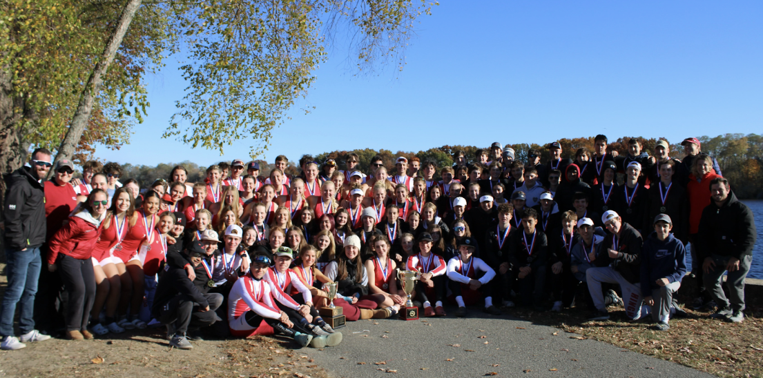 The boys and girls Hingham crew team, now state champions posing with their trophies and medals at MPSRA. 