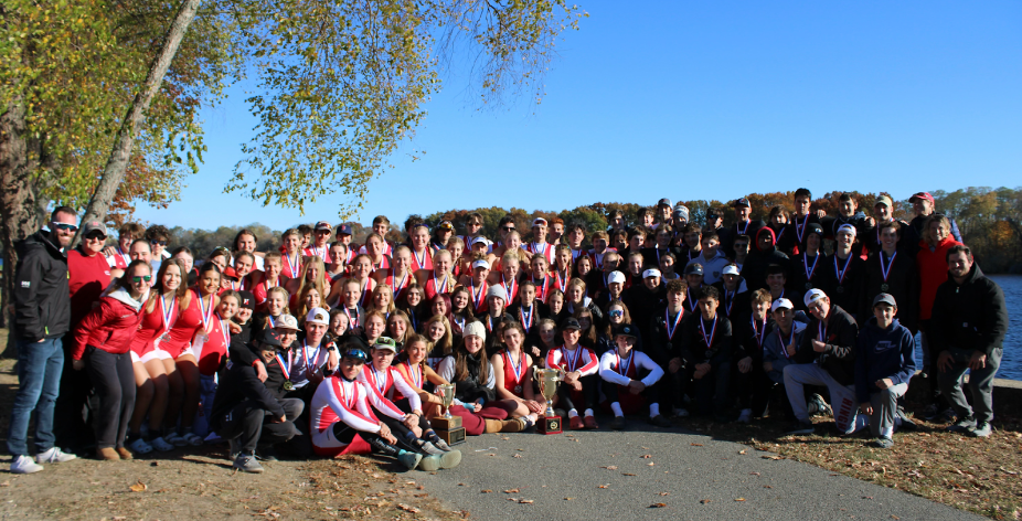 The boys and girls Hingham crew team, now state champions posing with their trophies and medals at MPSRA.