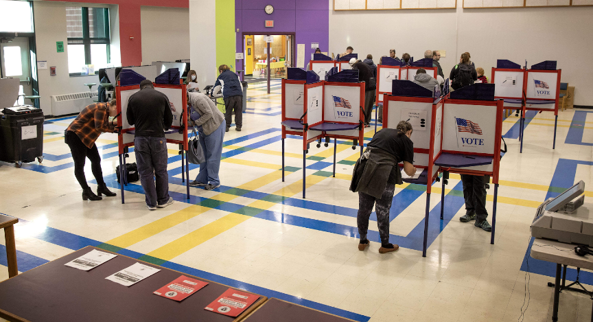 Massachusetts voters casting their votes at ballots in 2022. 