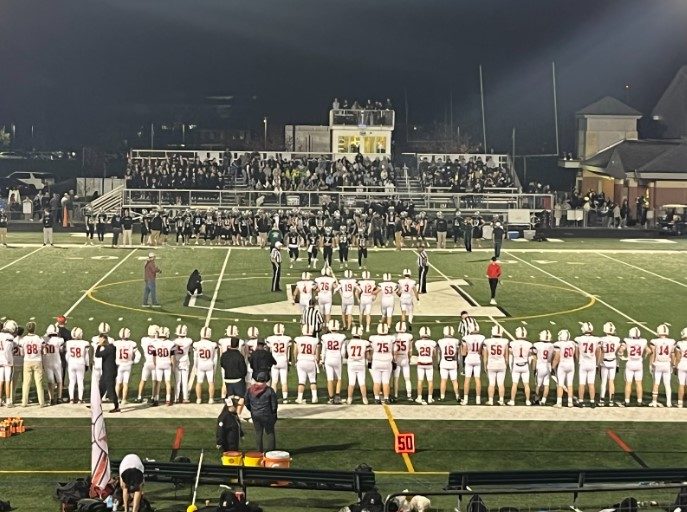 (Hingham football team as the captains walk out during their previous game against Duxbury. Photo credit: Vivien Nicholas)
