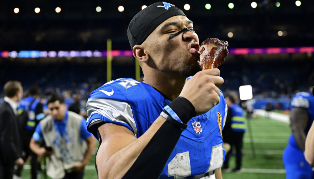  Lions receiver Amon-Ra St. Brown enjoying a turkey leg after a Thanksgiving day win.