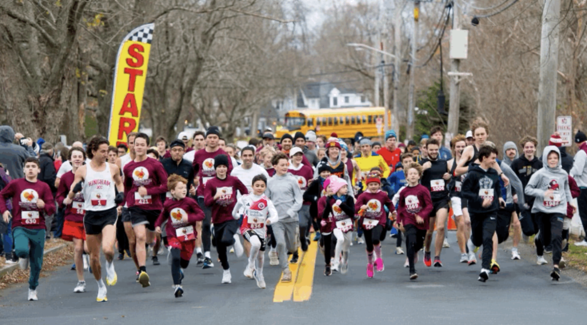 Excited runners begin the Hingham Turkey Trot outside of the High School.