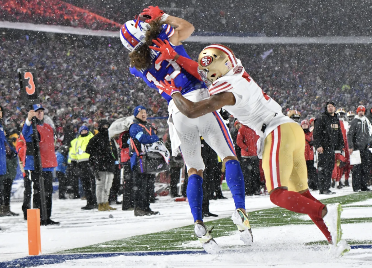 Buffalo Bills wide receiver Mack Hollins (13) leaps over San Francisco 49ers cornerback Charvarius Ward (7) during the second quarter at Highmark Stadium.