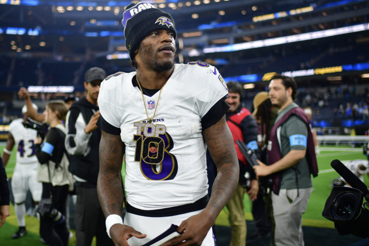 Baltimore Ravens quarterback Lamar Jackson (8) celebrates following a victory against the Los Angeles Chargers at Sofi Stadium.