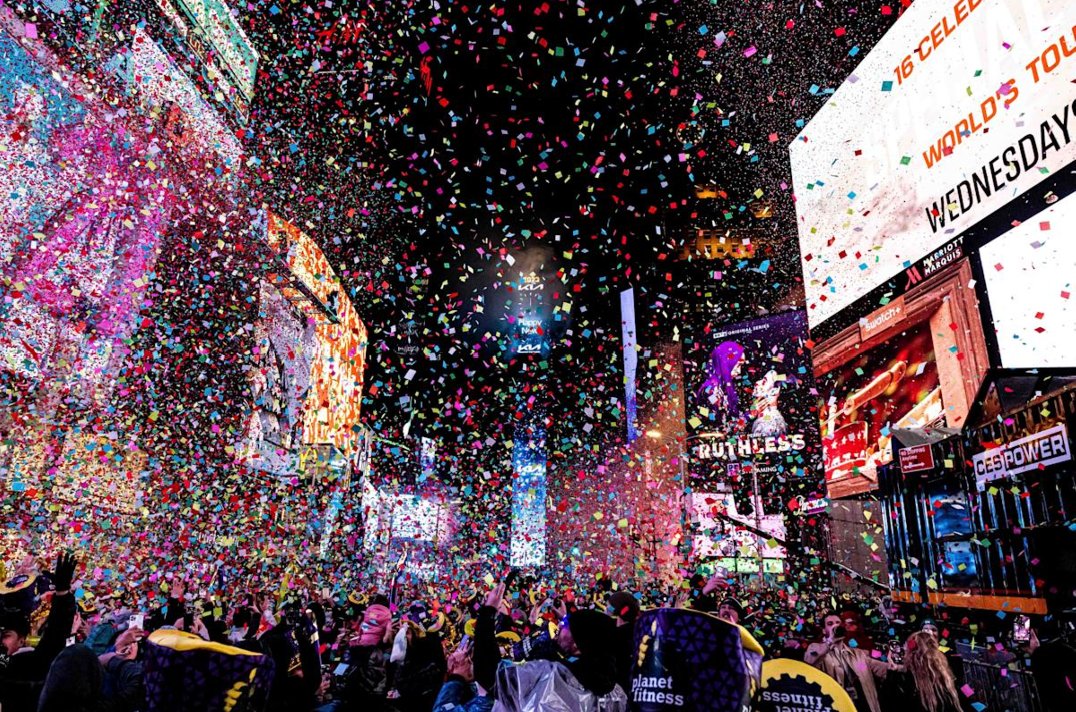 Confetti falls on a large crowd of people gathered in Times Square in New York City who are celebrating the arrival of the New Year after the Ball has dropped at midnight.  
