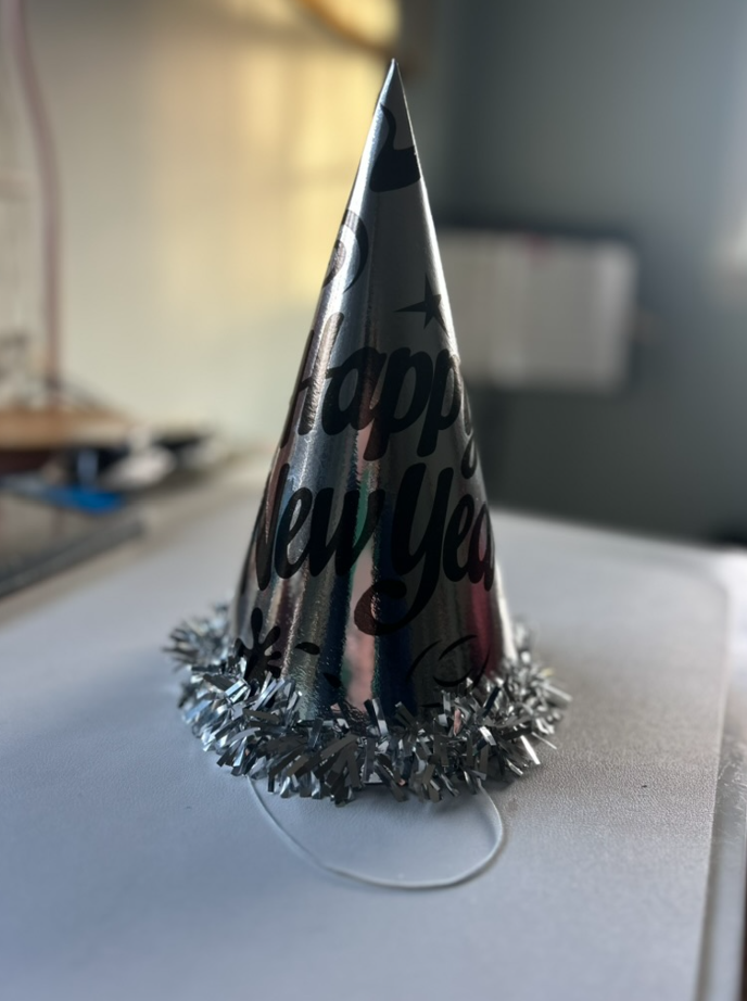 A student getting their party hat ready for the new year. 
