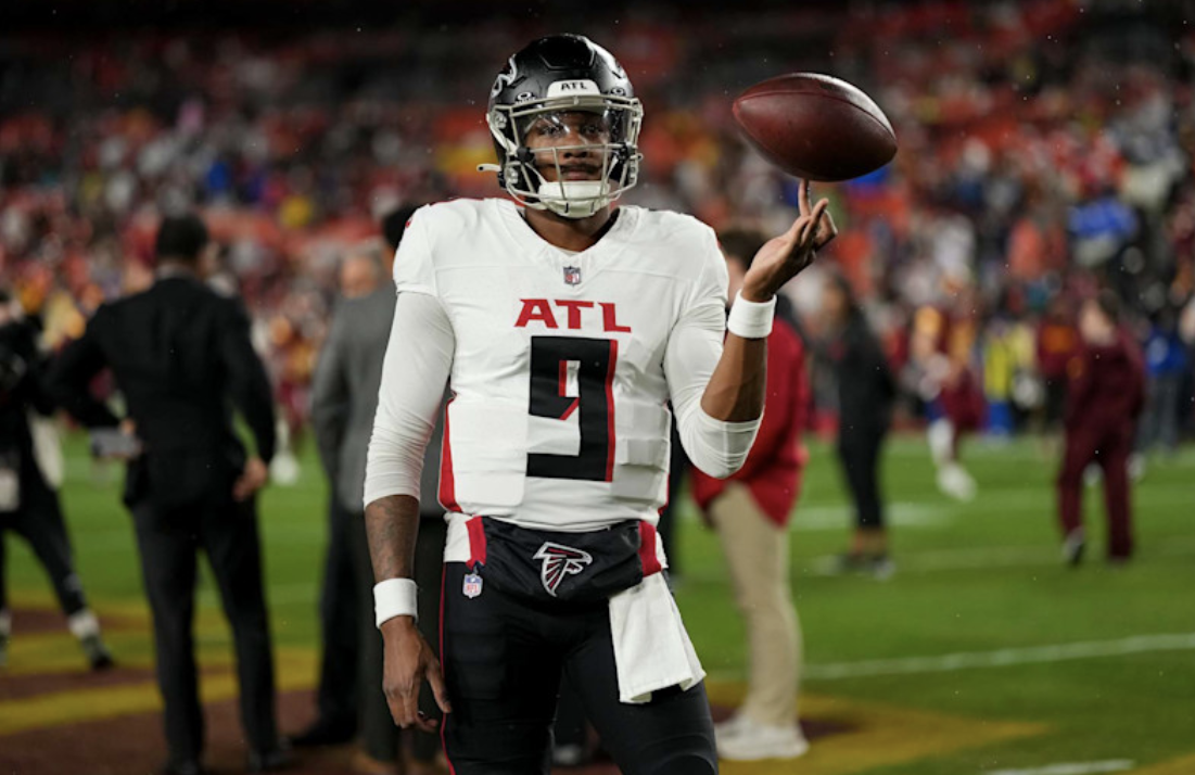 Rookie quarterback of the Atlanta Falcons, Michael Penix Jr., Spins a ball on his fingers (Todd Rosenberg/ Getty Images)