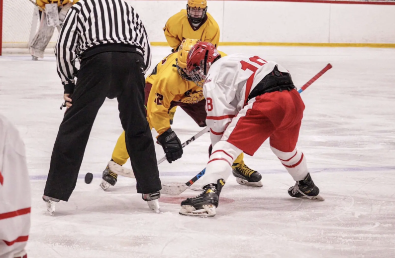 Colin Lasch taking a face off in a game against the Weymouth Rams