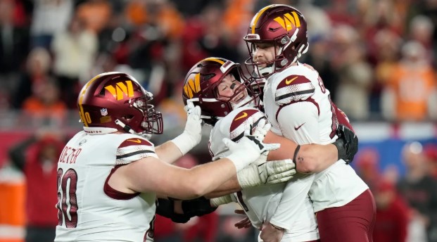 Washington Commanders kicker Zane Gonzalez celebrates with his teammates after hitting a game winning field goal against the Tampa Bay Buccaneers (Chris O'Meara)
