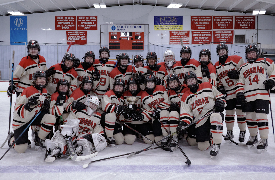 The girls hoisting the Hingham Cup after their 4-2 win against NDA.