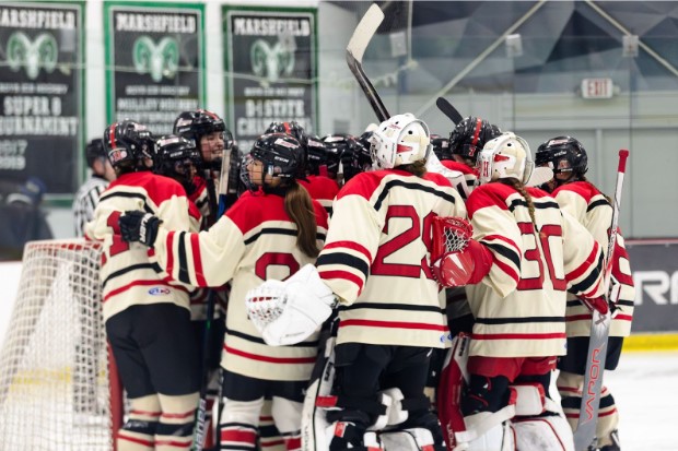 Harborwomen huddle in front of the net before a big game against NDA at the Bog in Kingston.
Photo Credits: Boston Yogi
