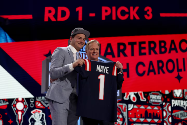 Drake Maye poses alongside NFL Commissioner Roger Goodell after being drafted third overall by the Patriots. 