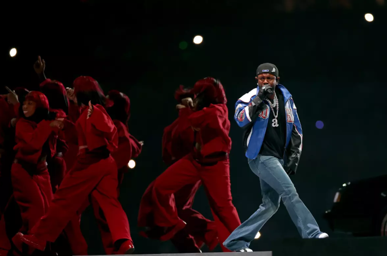 Kendrick Lamar performs at the Super Bowl Halftime show singing his massive hit ‘Not Like Us’ (Credit: Gregory Shamus)
