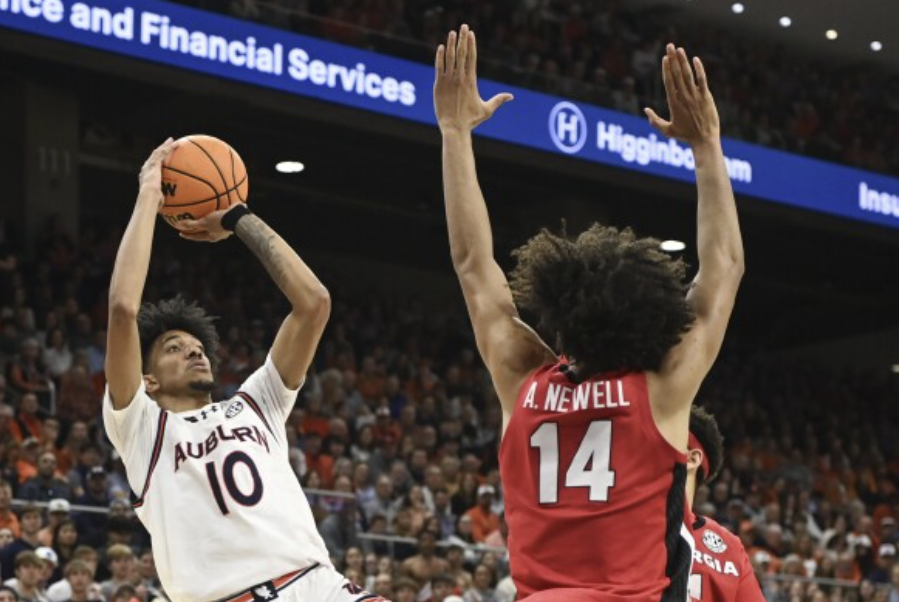 Forward Chad Baker-Mazara of #1 Auburn shoots a fade-away jump shot to beat the shot clock.