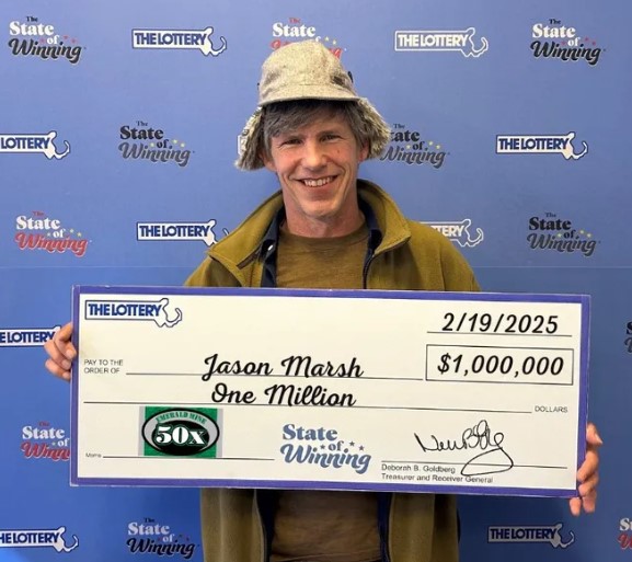 Million dollar lottery ticket winner poses with prize after purchasing ticket in Hingham
Photo Creds: Scott Bowdridge of The Patriot Ledger
