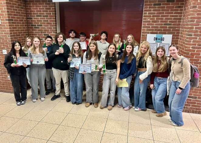 The Hingham High School Debate Team standing together to take a team photo after their final in Bridgewater Raynham High School. (Robb Giardino)
