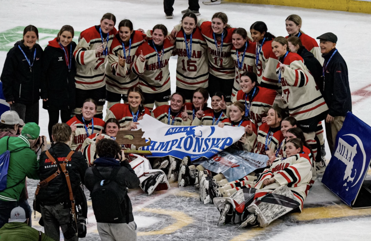 The Girl’s Hockey Team poses for a photo after winning the MIAA Girls D1 State Championship