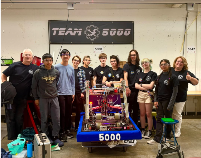 Mrs. Flanagan (far right) and her robotics team pose after a competition at WPI in April of 2024.

