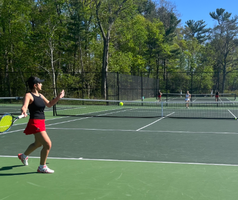 Senior Sanya Khadivi makes a killer forehand on the second singles court.
