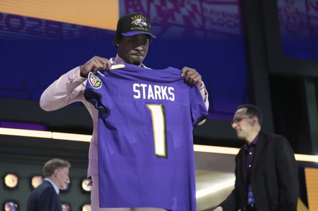 Raven’s First-Round Pick Malaki Starks poses for Fans after he was selected.