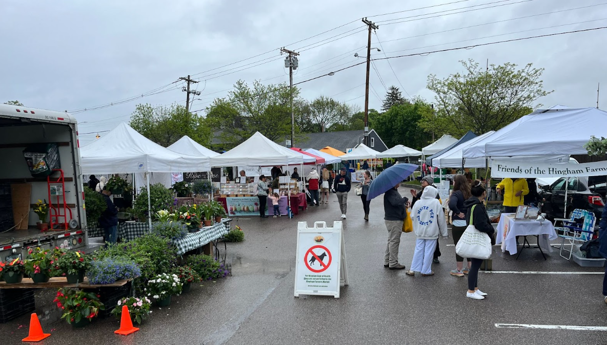 Shoppers browse through the selection of different products at the Hingham Farmers Market