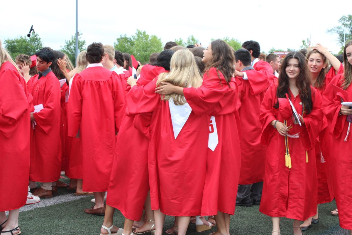 Moments after receiving their diplomas, the seniors are wild with celebration. 