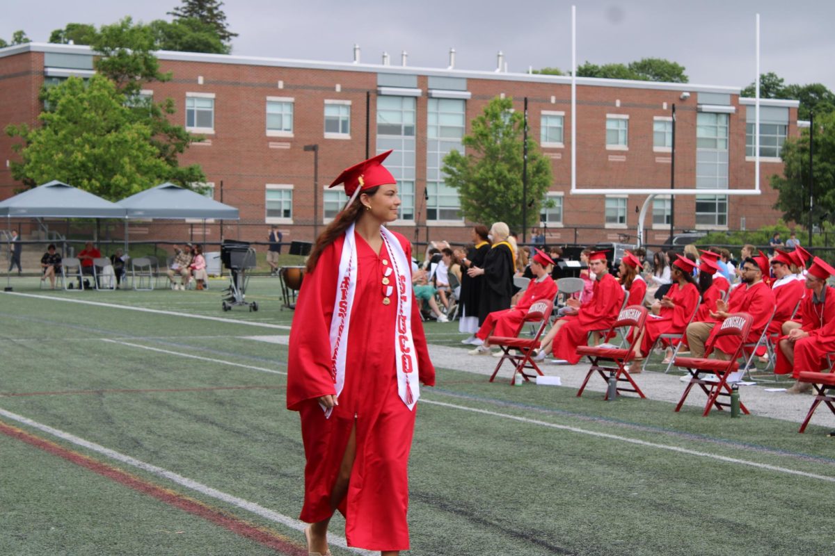 Charlotte Bernstein gives a smile to her classmates before receiving her diploma. 