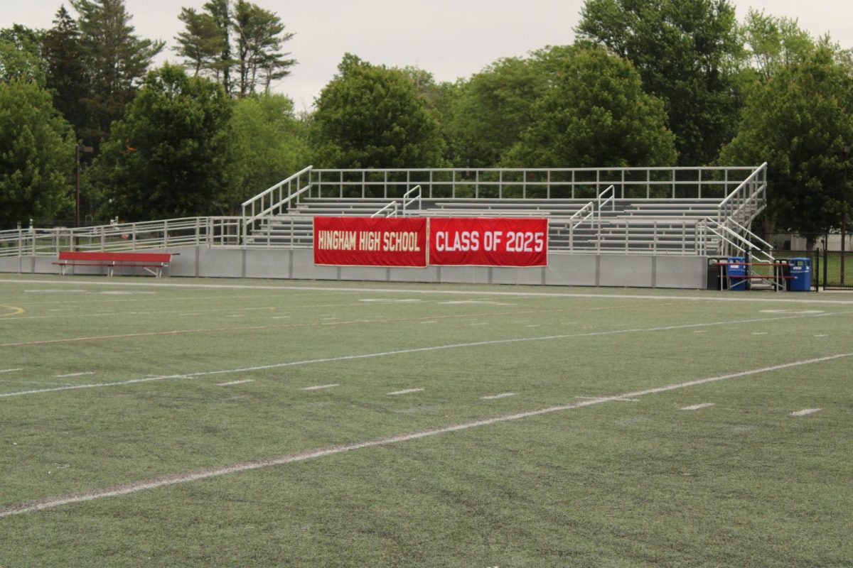 The Hingham High Turf was decorated with the tradition “Hingham High School” red banner and the new “Class of 2025” banner. 