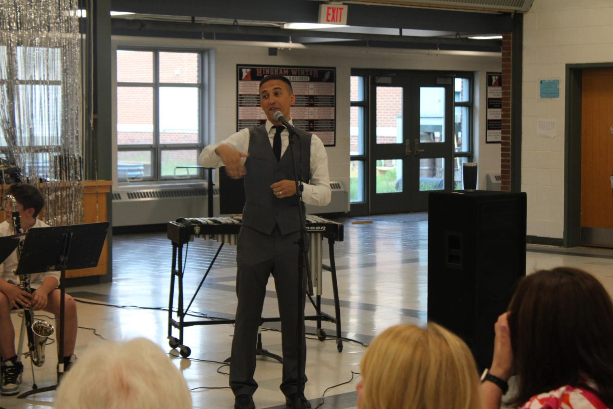 Band Director Brian Cincotta speaks to a crowd.