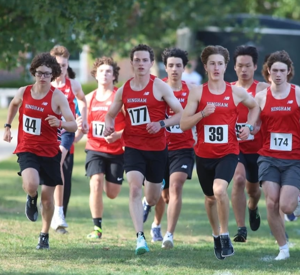 The Hingham boys cross country team flies off the starting line against Whitman-Hanson.