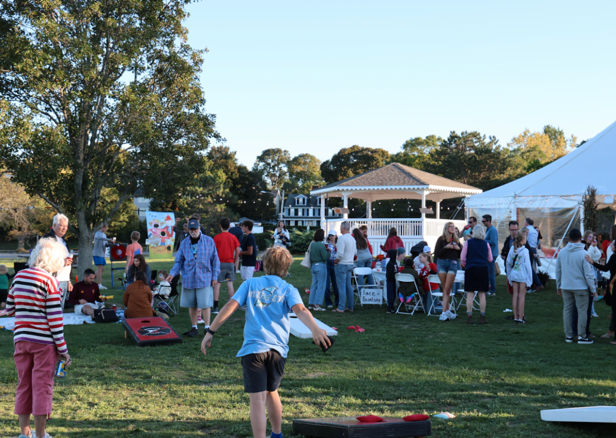 Attendees of Saturday’s Fall Fest enjoy the many activities before the sun sets.
