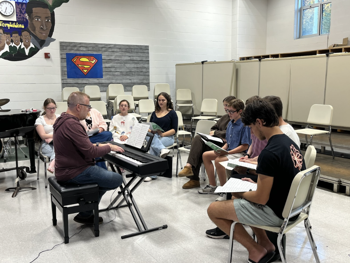 Some of the members of the Encore group are starting to learn and run through their first song of the year.
