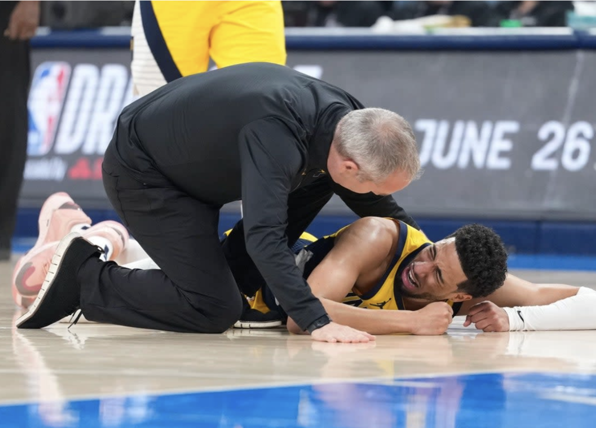 Indiana Pacers star Tyrese Haliburton falls to the floor after suffering a torn achilles in Game 7 of the NBA finals.