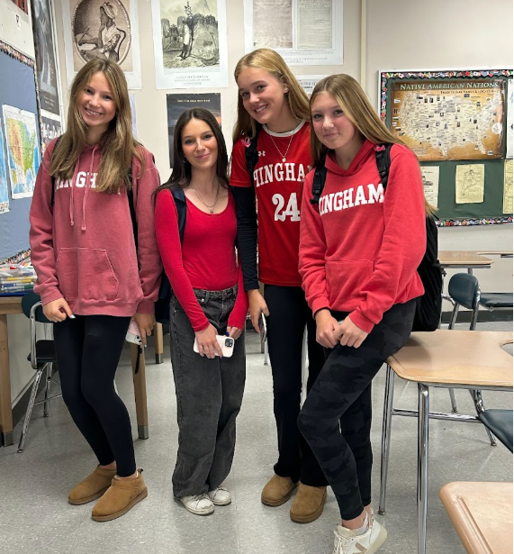 Students Isla Hase, Rory Bray, Zoe Jones, and Abby Cosman take part in Red Out Day for spirit week. 
