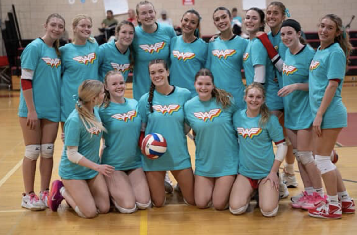 The Hingham Harbowomen wear Adelia Strong shirts for warmups.