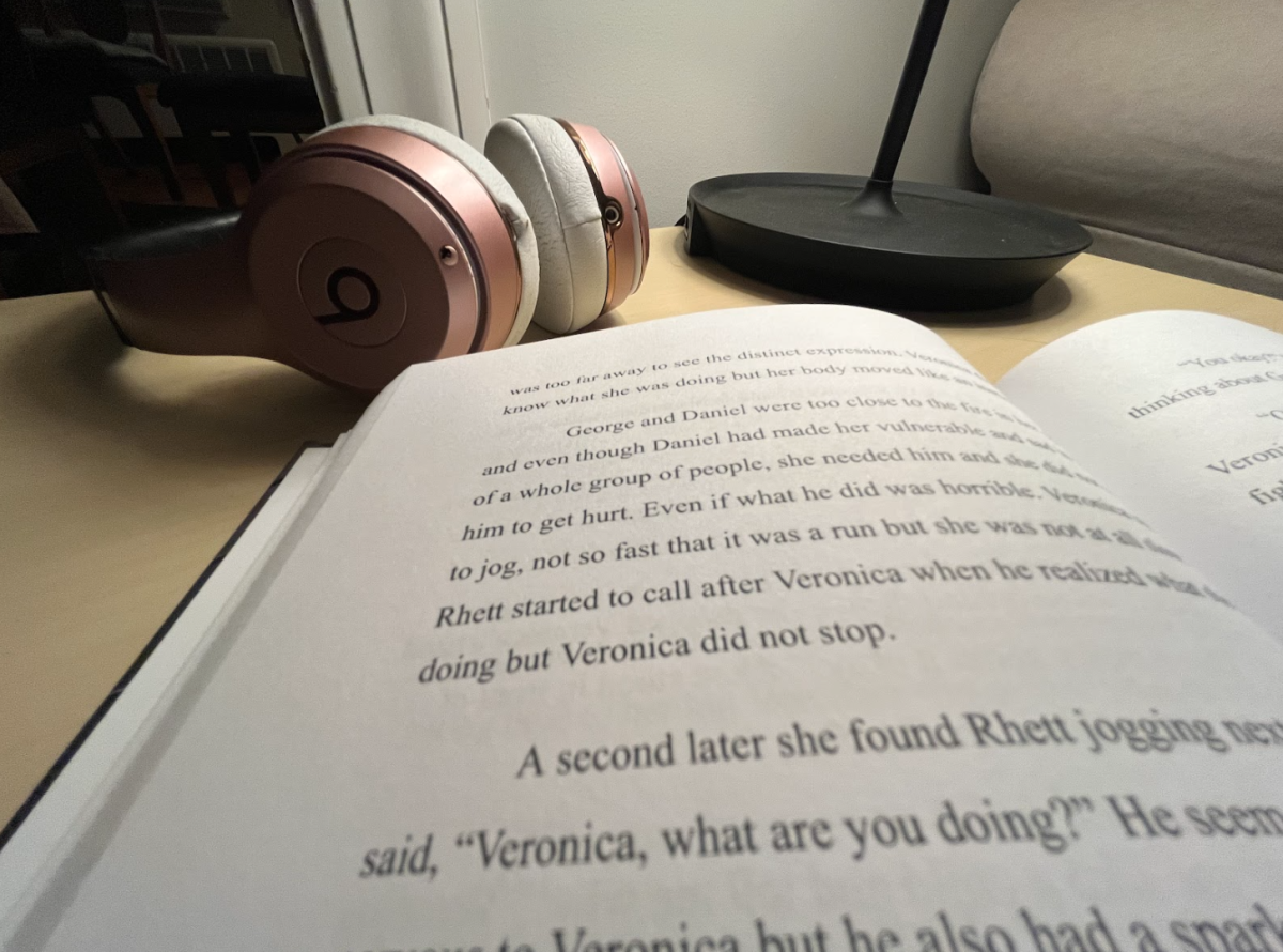 A book, headphones and soft lighting creates a cozy atmosphere, great for getting immersed in a book.