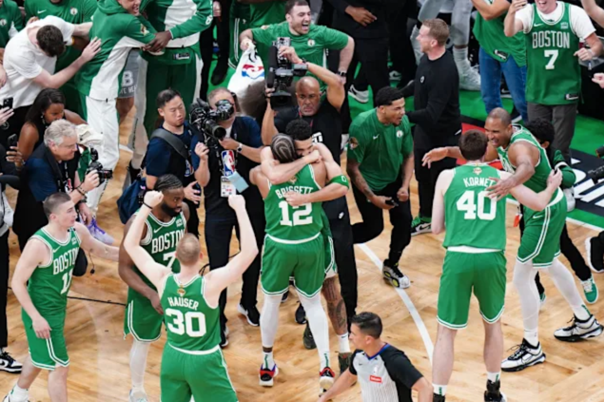 Boston Celtics Forward Jayson Tatum (0) celebrates with his teammate Oshae Brissett (12) after an exciting win.