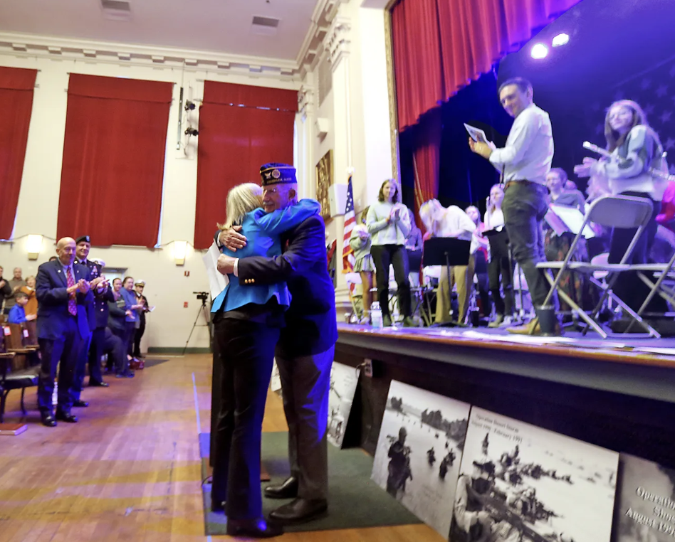 Janine Suchecki and Arthur Smith being remembered in the Veterans Day ceremony at Hingham Town Hall. 