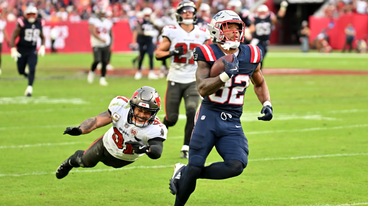 Patriots rookie running back Treveyon Henderson runs for his first of two touchdowns during Sunday’s win.