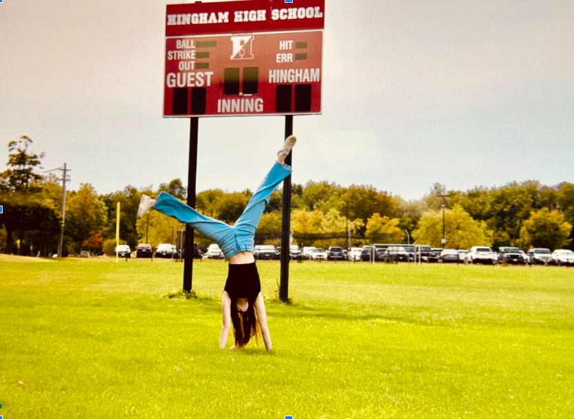 Sadie Ferrara, a student at HHS, does a cartwheel for the theme “Driven” in their photography class. 

