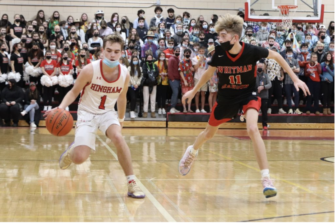Hingham Alum, Curtis Murphy, dribbles the ball against Whitman-Hanson in the 2021-2022 season.