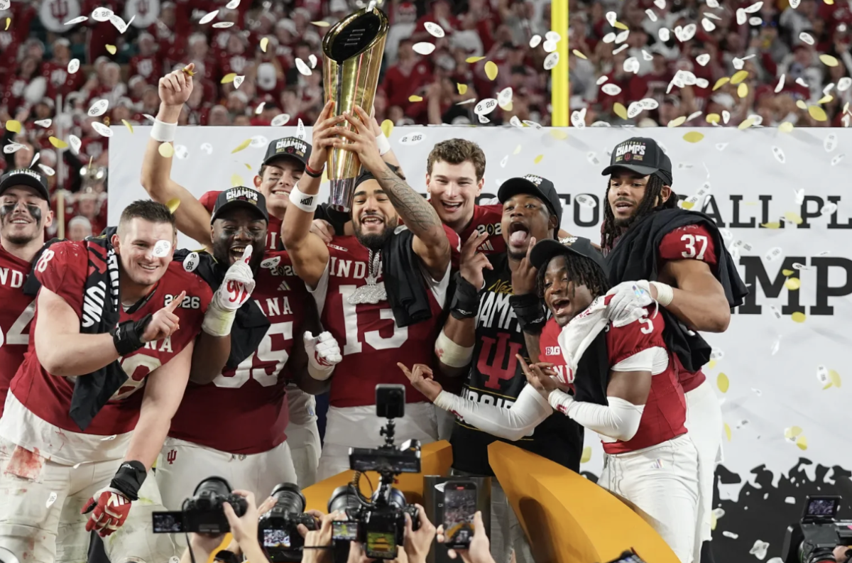 Indiana’s star football players hoist the trophy after defeating Miami in the College Football National Championship.