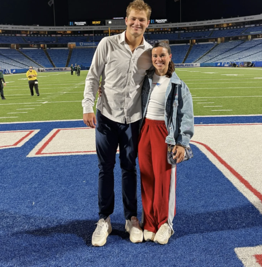 Ann Michael Maye poses with star quarterback Drake Maye, debuting her latest fashion pick.